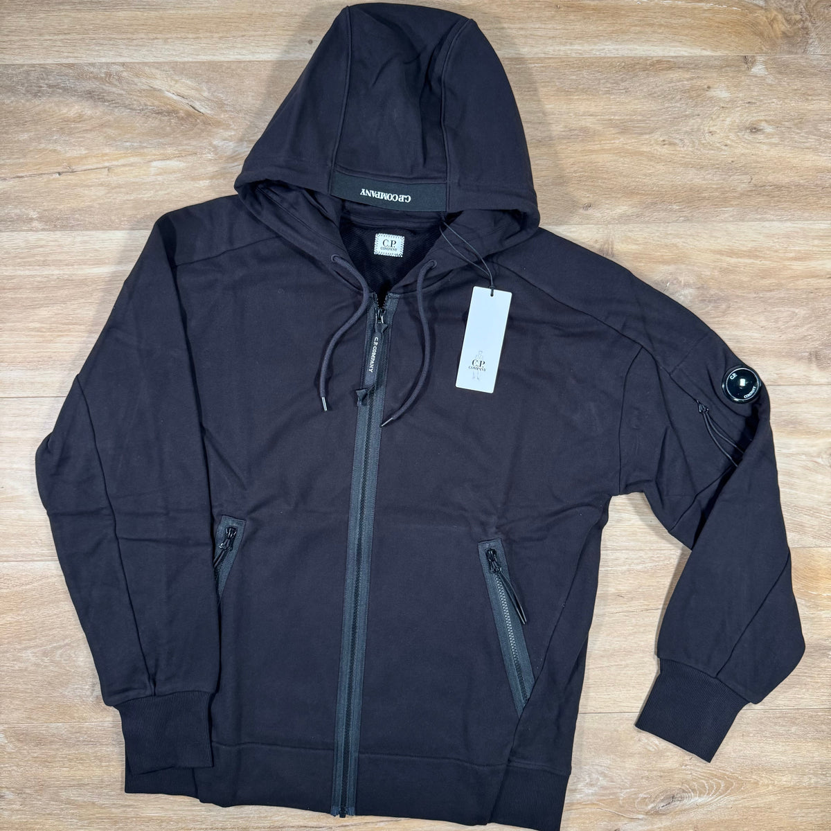 C.P. Company Diagonal Raised Zipped Lens Hoodie in Black