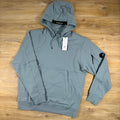 C.P. Company Diagonal Raised Fleece Lens Hoodie in Silver Blue