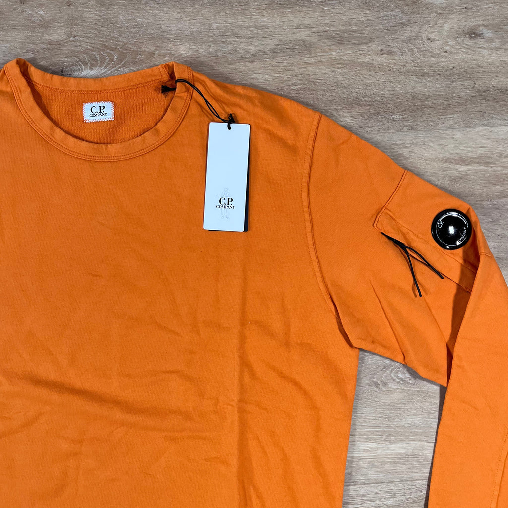 C.P. Company Light Fleece Crewneck Lens Sweatshirt in Russet Orange